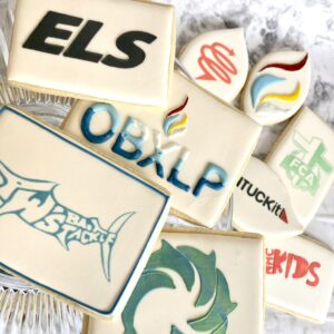 Cookies decorated with various logos.